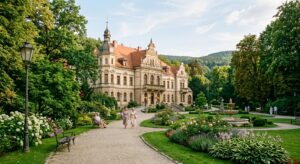 A professional, editorial-style photograph of a picturesque spa resort in Lower Silesia, featuring e