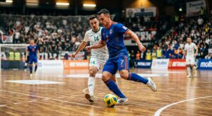 A high-quality, professional editorial photograph capturing a dynamic moment of a futsal match on a