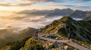 A stunning, high-angle cinematic landscape shot of a scenic lookout point over a misty mountain rang