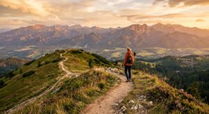 A high-angle editorial photograph of a scenic, gently sloping mountain trail in the Lesser Poland re